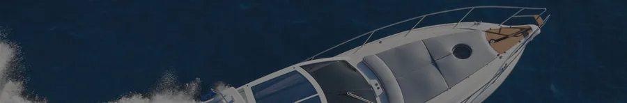 Aerial view of the foredeck of a motor cruiser under way on deep blue water